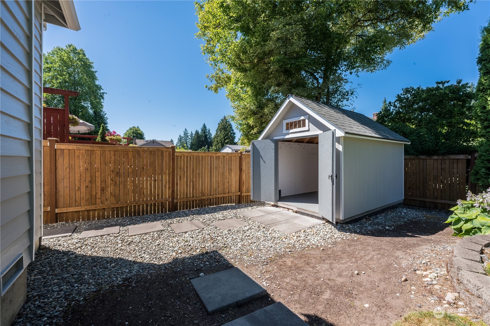 24224 16th Place Southeast Bothell, WA 98021 - Photo 36 of 37 a view of backyard of house with wooden fence
