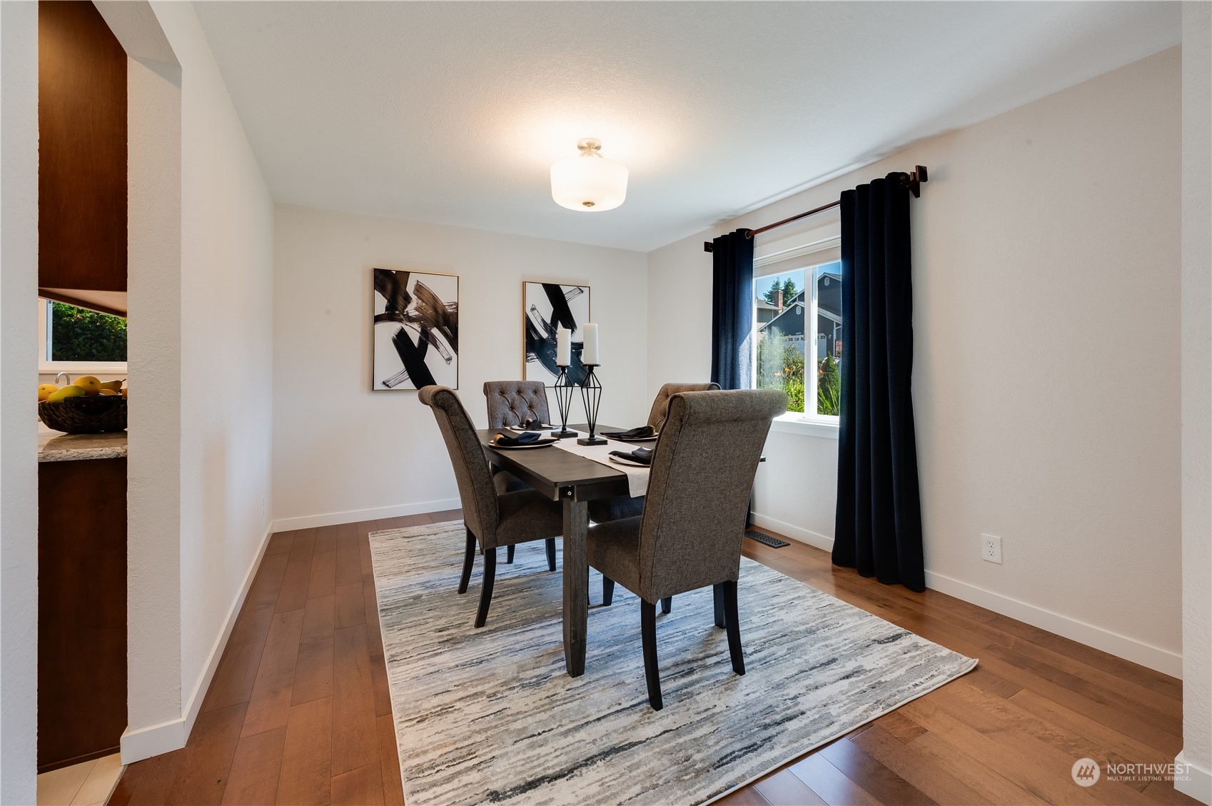 24224 16th Place Southeast Bothell, WA 98021 - Photo 9 of 37 a view of a dining room with furniture and wooden floor