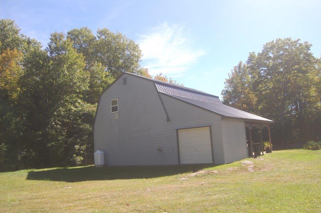 269 Atkins Road Jefferson, ME 04348 - Photo 7 of 31 BACK EXTERIOR WITH CARPORT