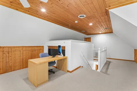 a workspace with furniture and white walls