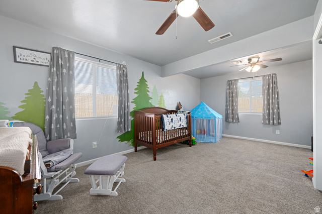 348 North Lodge Road Central, UT 84722 - Photo 6 of 25 Carpeted bedroom featuring a nursery area and a ceiling fan