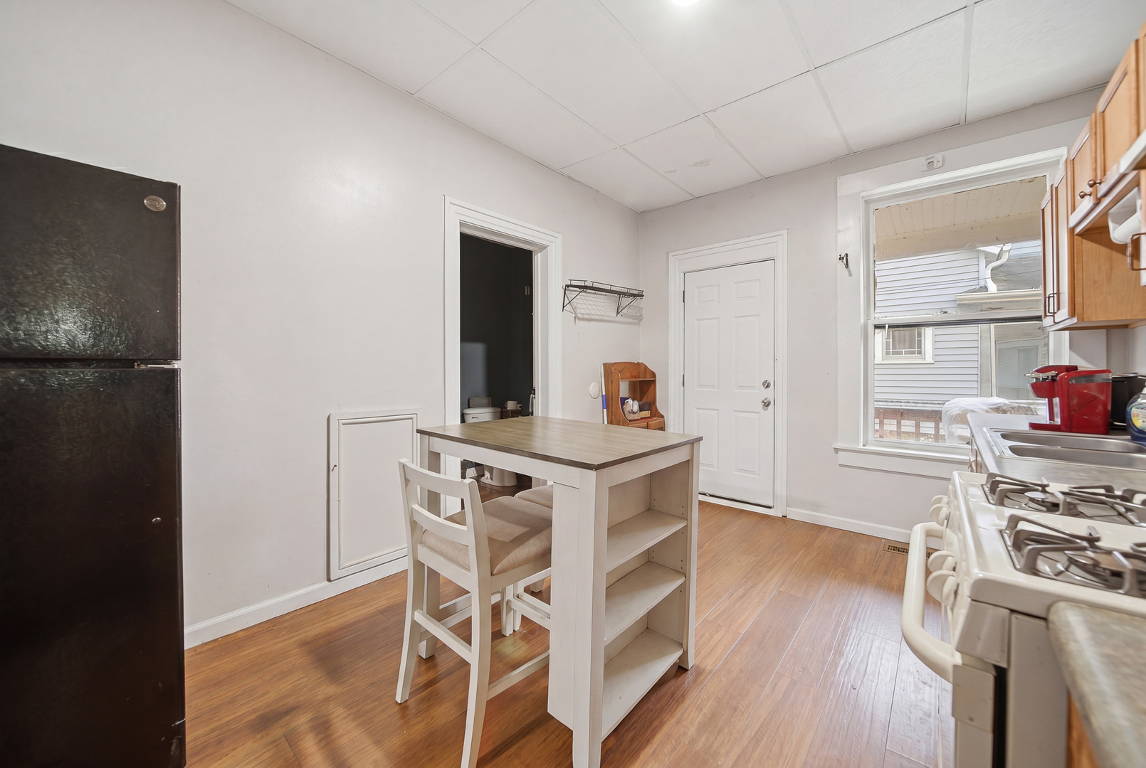 305 Monroe Avenue Dixon, IL 61021 - Photo 29 of 36 a view of a dining room with furniture and wooden floor