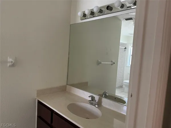 a bathroom with a sink and mirror
