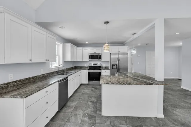 a large kitchen with cabinets