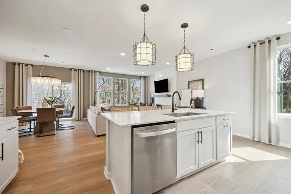 a kitchen with center island and windows