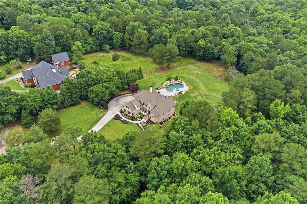 2950 Callie Still Road Lawrenceville, GA 30045 - Photo 69 of 77 an aerial view of residential house with outdoor space and trees all around