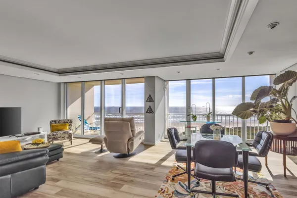 a living room with furniture and a large window