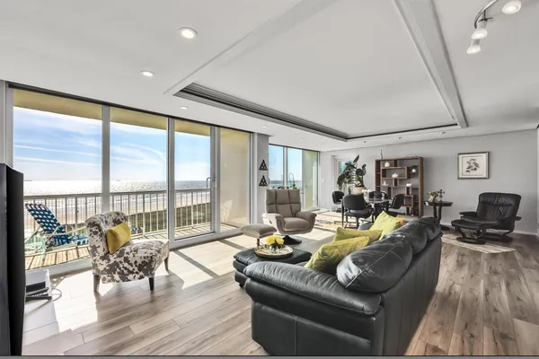 a living room with furniture and a large window
