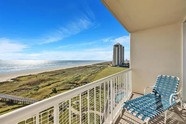 a view of a balcony with an ocean view