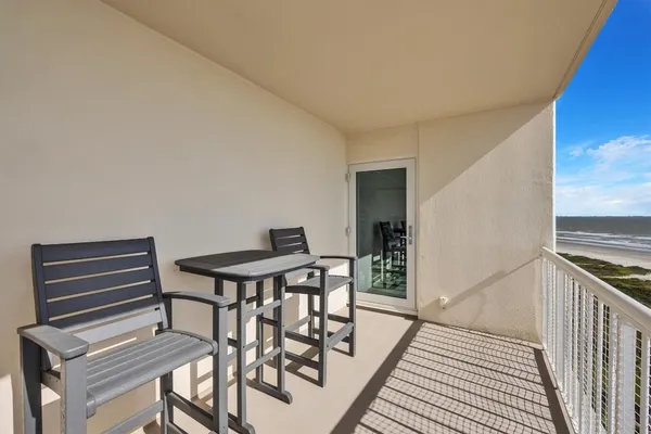 a view of a livingroom with furniture and stairs