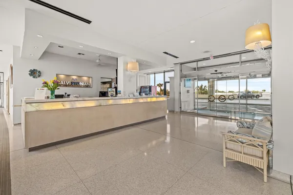 a kitchen with stainless steel appliances kitchen island granite countertop a sink and cabinets