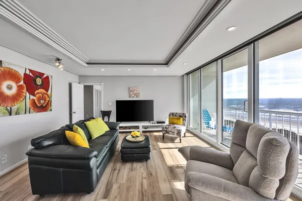 a living room with furniture and a flat screen tv