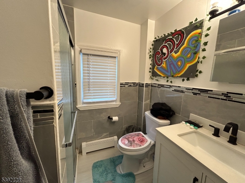 63 Grant Avenue East Hanover, NJ 07936 - Photo 11 of 19 a bathroom with a sink and a toilet