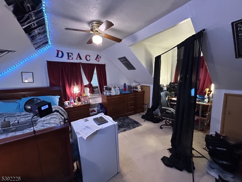 63 Grant Avenue East Hanover, NJ 07936 - Photo 12 of 19 a room with furniture and flat screen tv