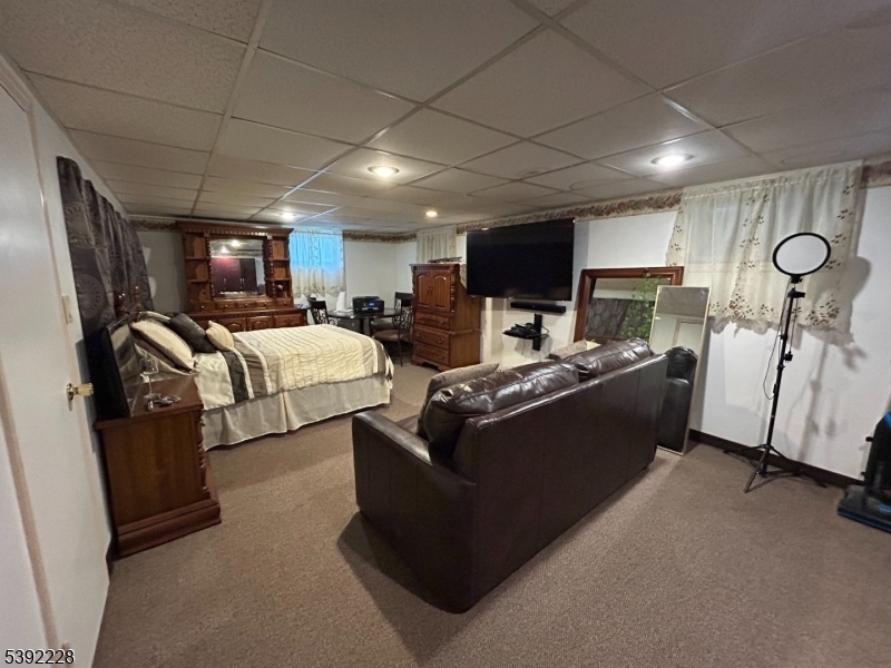 63 Grant Avenue East Hanover, NJ 07936 - Photo 13 of 19 a living room with furniture and a flat screen tv