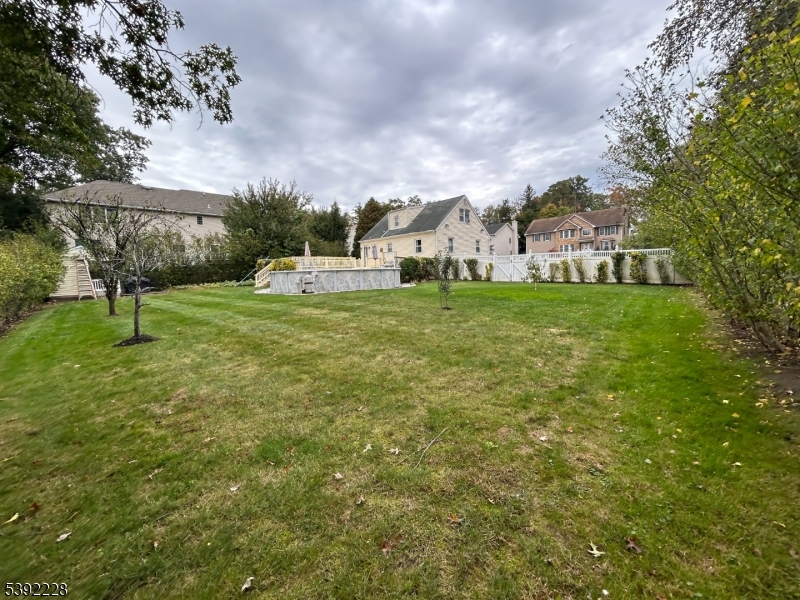 63 Grant Avenue East Hanover, NJ 07936 - Photo 16 of 19 a view of a big yard with potted plants and large trees