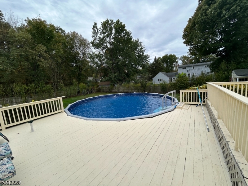 63 Grant Avenue East Hanover, NJ 07936 - Photo 17 of 19 a view of balcony with wooden floor and outdoor seating