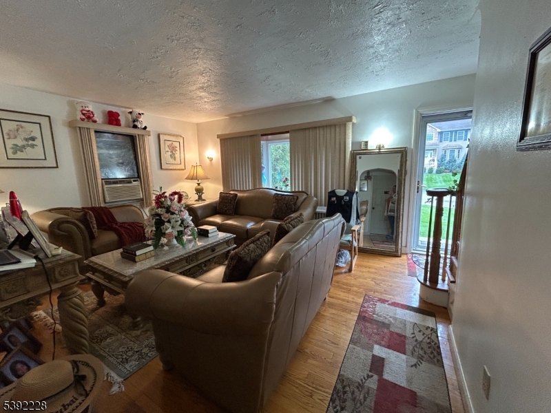 63 Grant Avenue East Hanover, NJ 07936 - Photo 3 of 19 a living room with furniture and a fireplace