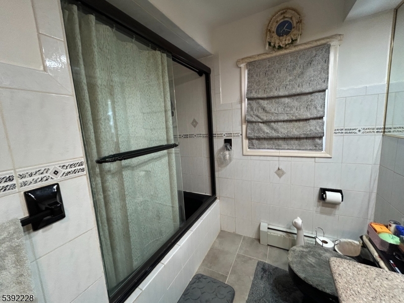 63 Grant Avenue East Hanover, NJ 07936 - Photo 7 of 19 a bathroom with a sink toilet and shower