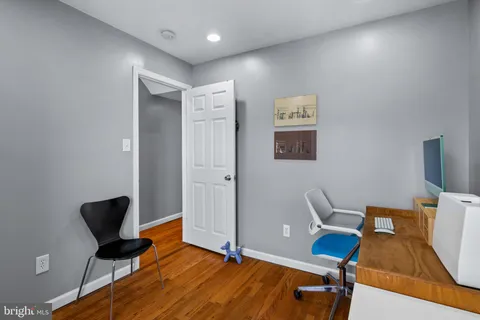 a workspace with furniture and wooden floor