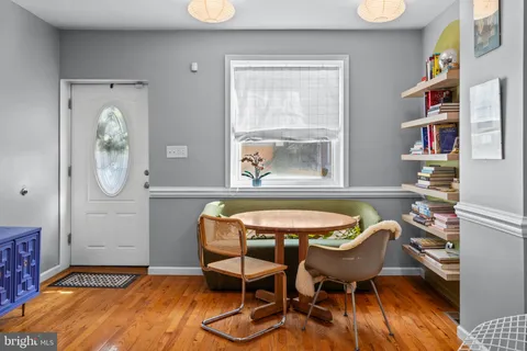a dining room with furniture and window