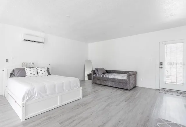 a bedroom with bed and window