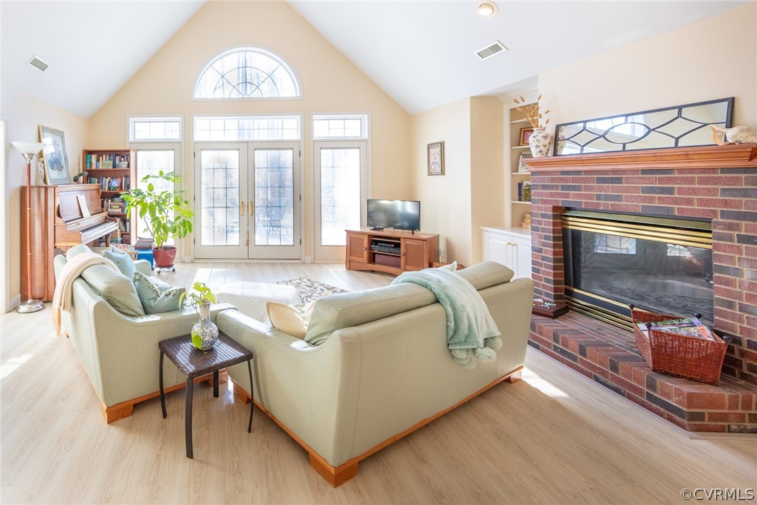 1841 Covington Road Crozier, VA 23039 - Photo 13 of 50 a living room with furniture a flat screen tv and a fireplace