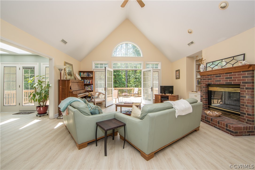 1841 Covington Road Crozier, VA 23039 - Photo 15 of 50 a living room with furniture a large window and a fireplace