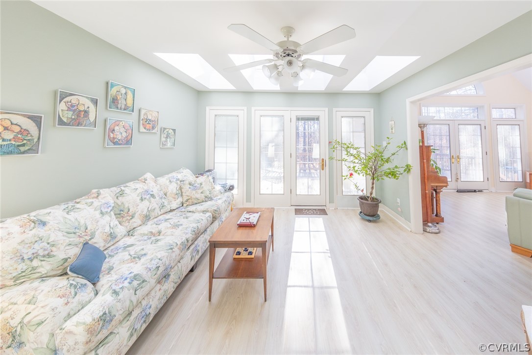 1841 Covington Road Crozier, VA 23039 - Photo 17 of 50 a spacious bedroom with a large bed and a chandelier