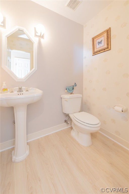 1841 Covington Road Crozier, VA 23039 - Photo 20 of 50 a white toilet sitting next to a bathroom sink