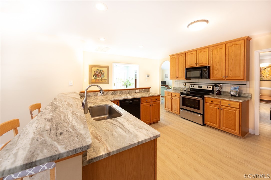 1841 Covington Road Crozier, VA 23039 - Photo 25 of 50 a kitchen with stainless steel appliances granite countertop a sink and a stove
