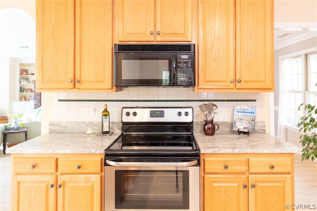1841 Covington Road Crozier, VA 23039 - Photo 26 of 50 a stove top oven sitting inside of a kitchen