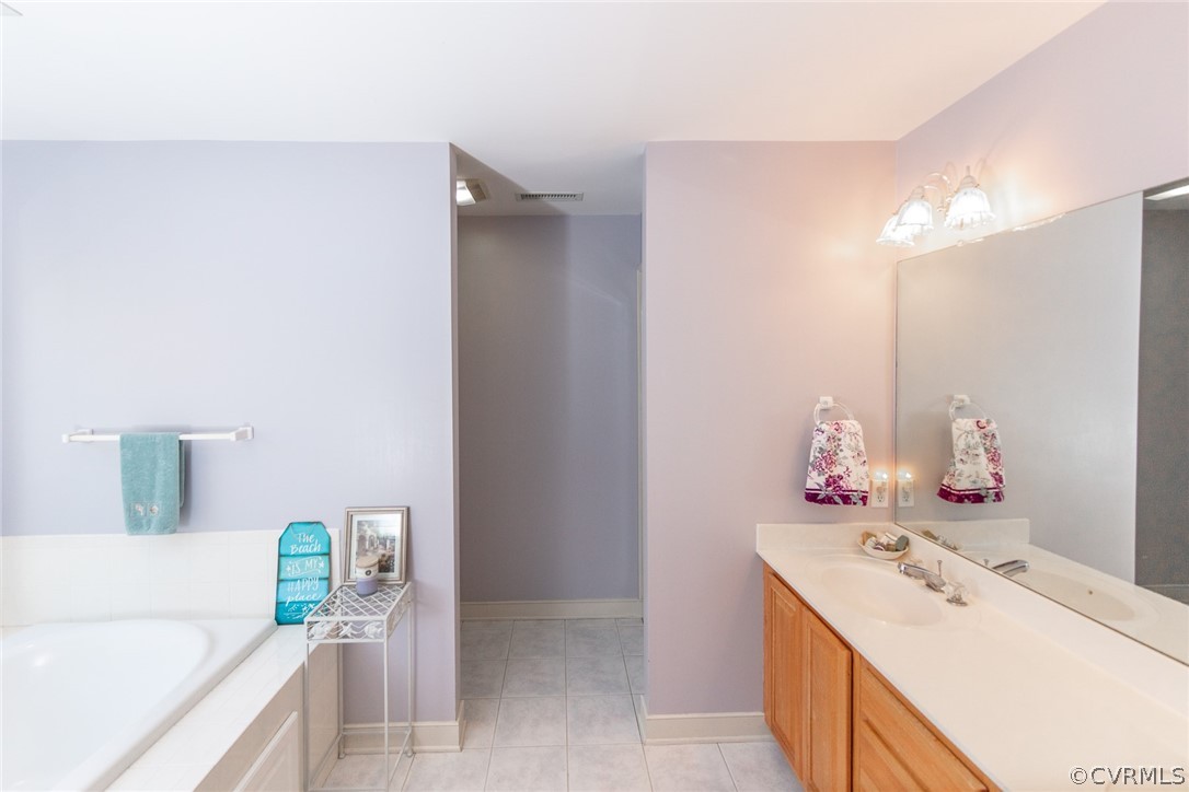 1841 Covington Road Crozier, VA 23039 - Photo 30 of 50 a bathroom with a sink and a mirror
