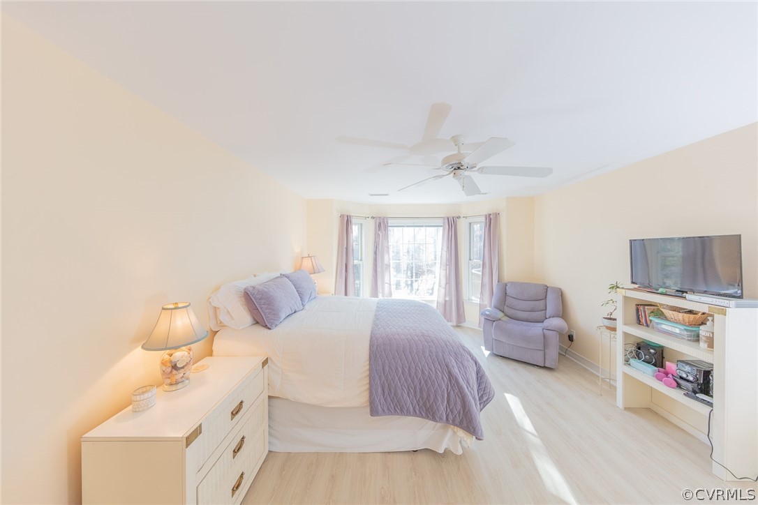 1841 Covington Road Crozier, VA 23039 - Photo 32 of 50 a bedroom with a bed and a couch