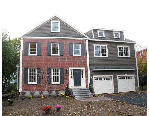 106 Stowecroft Road Arlington, MA 02474 - Photo 1 of 15 a front view of a house with yard