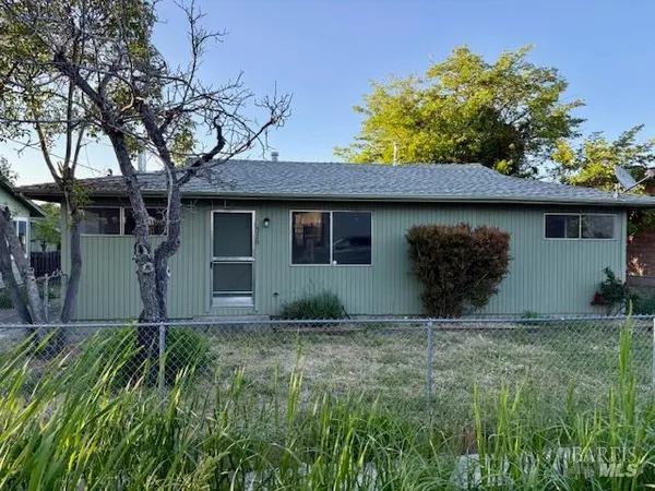 a house with trees in the background
