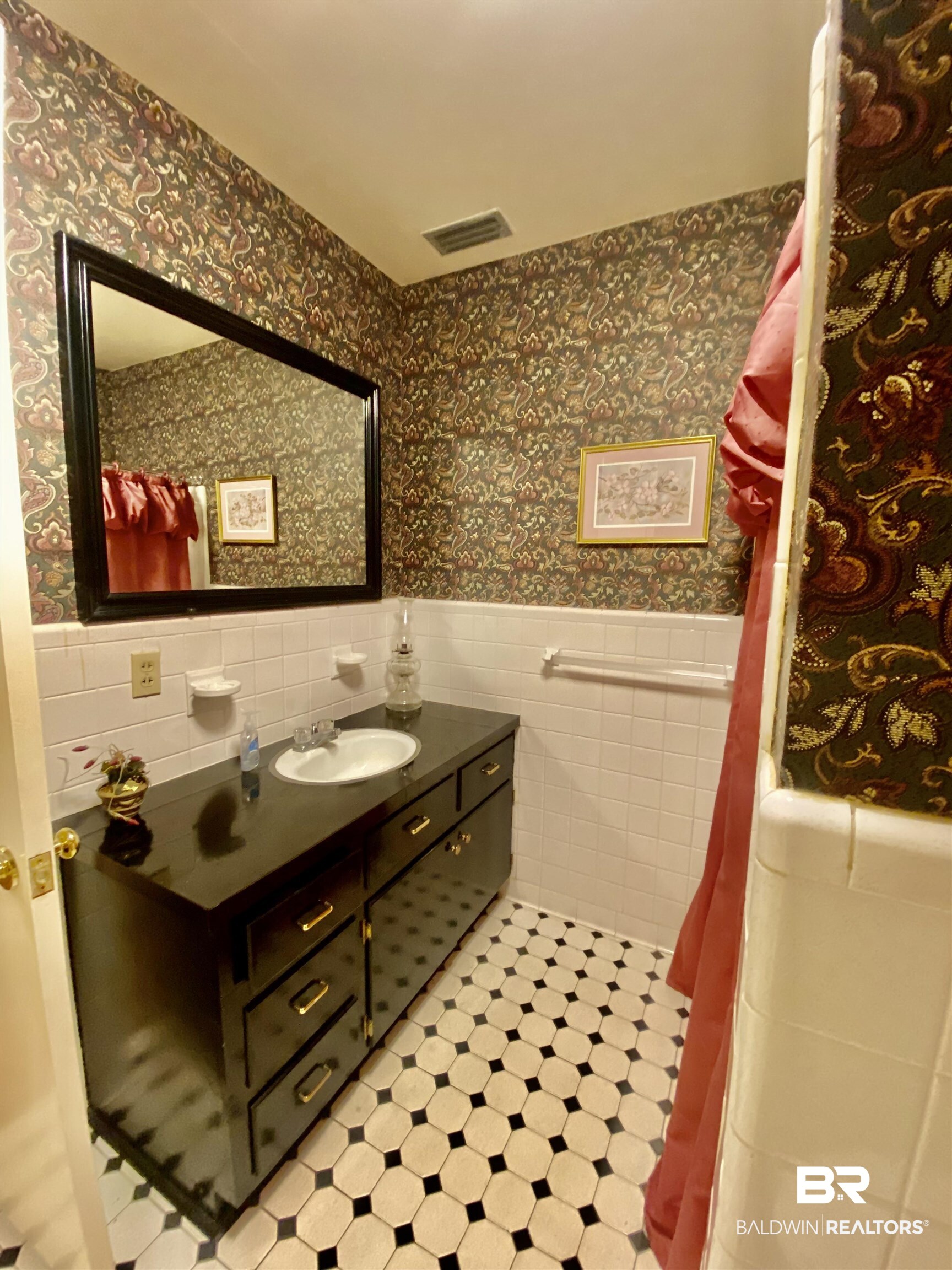 272 Longleaf Circle Monroeville, AL 36460 - Photo 29 of 38 Bathroom adjacent to Bedroom 4, with tile walls and vanity.