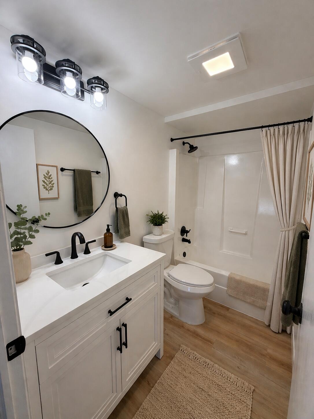 601 Holly Lane Griffith, IN 46319 - Photo 16 of 44 a bathroom with a sink a toilet and a mirror