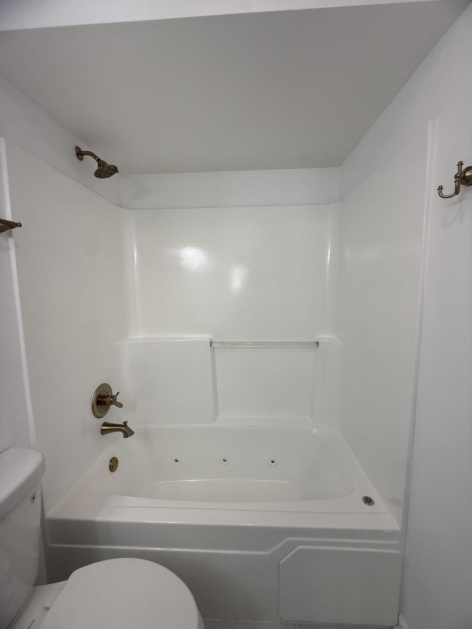 601 Holly Lane Griffith, IN 46319 - Photo 28 of 44 a bathroom with a shower and a toilet