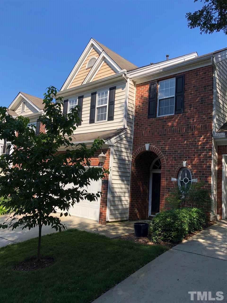6822 Middleboro Drive Raleigh, NC 27612 - Photo 1 of 13 a front view of a house with a yard