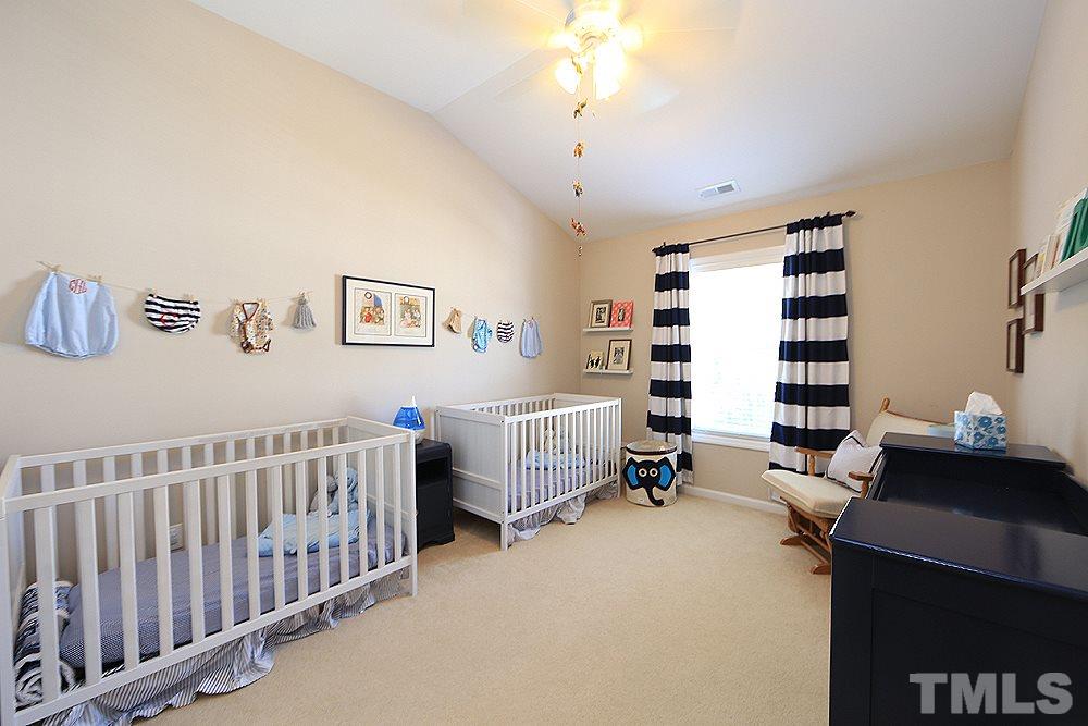 6822 Middleboro Drive Raleigh, NC 27612 - Photo 11 of 13 a bedroom with furniture and a window