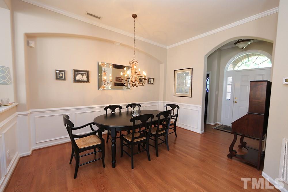 6822 Middleboro Drive Raleigh, NC 27612 - Photo 4 of 13 a view of a dining room with furniture and wooden floor