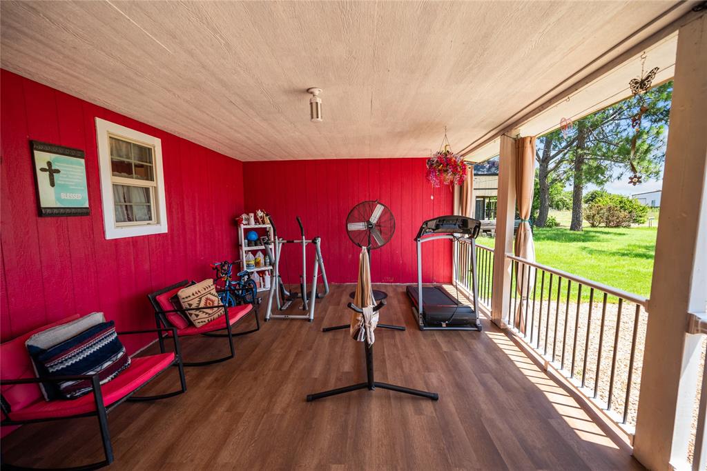 447 Masthead Road Gun Barrel City, TX 75156 - Photo 8 of 27 a view of a livingroom with furniture wooden floor and windows