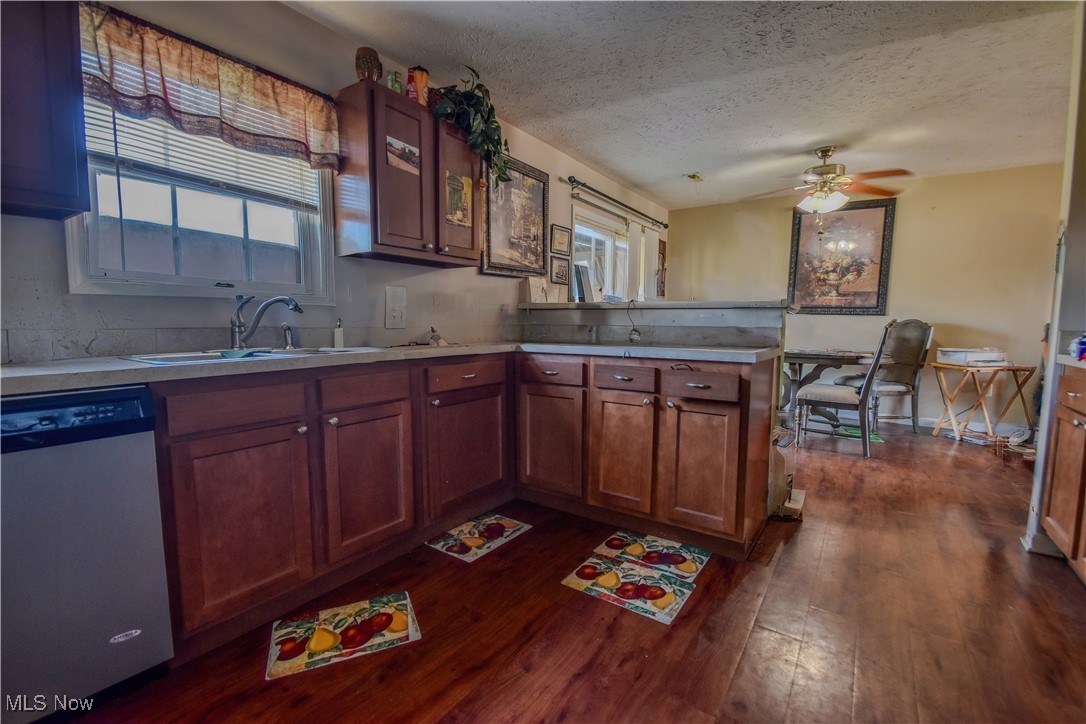 643 Wood Ridge Road Geneva, OH 44041 - Photo 15 of 24 Kitchen with a healthy amount of sunlight, dishwasher, a peninsula, and a sink