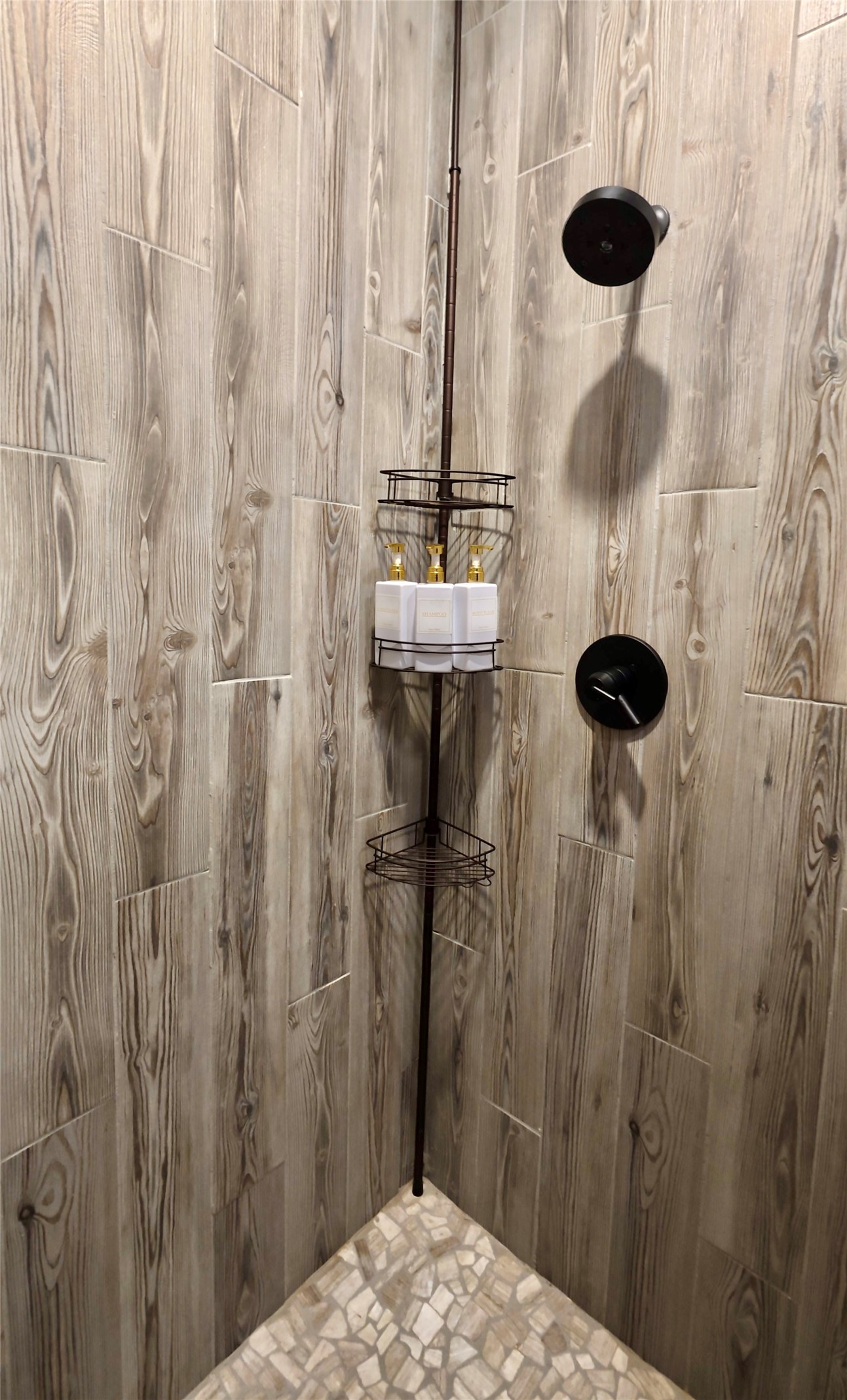 114495 South 4296th Road Porum, OK 74455 - Photo 37 of 59 Shower enclosure featuring wood-finish wall tiling and a mosaic stone floor