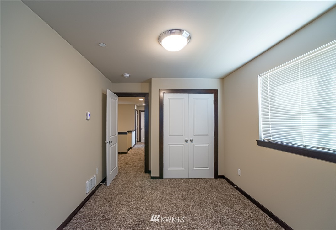 604 Morris Avenue South Renton, WA 98057 - Photo 15 of 21 an empty room with closet and a window
