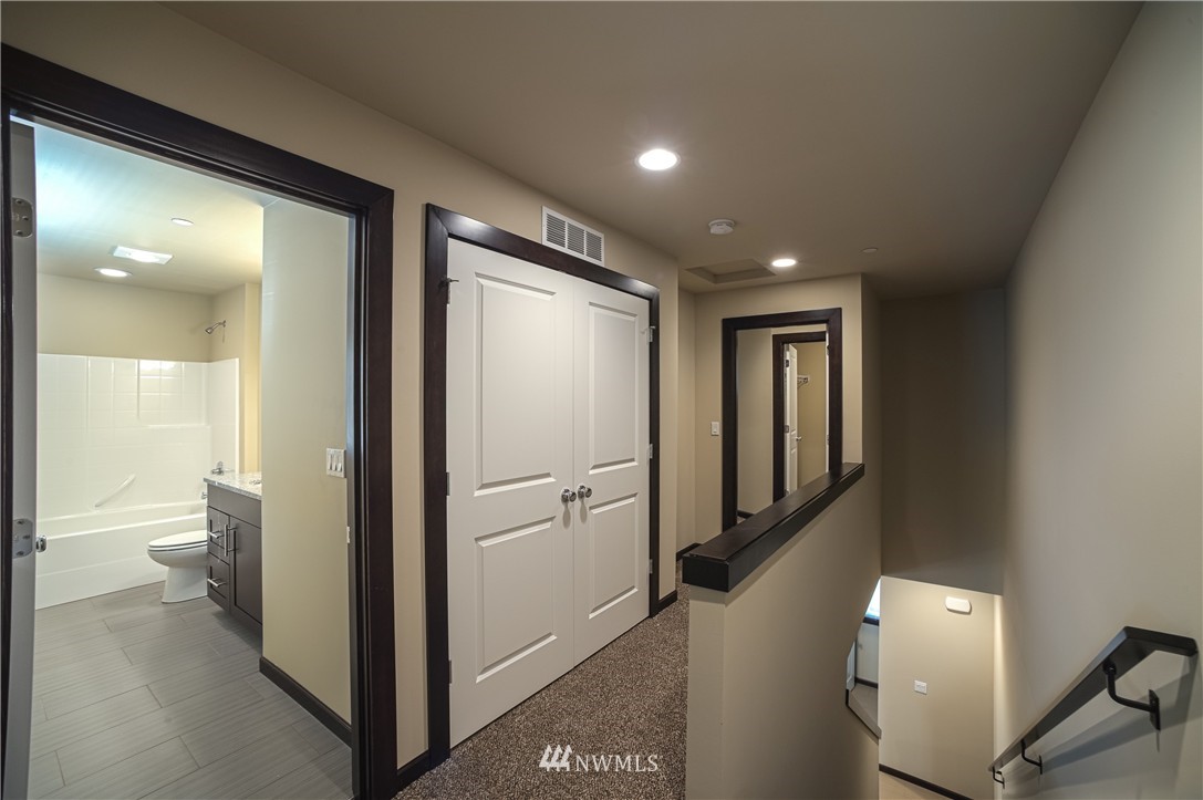 604 Morris Avenue South Renton, WA 98057 - Photo 4 of 21 a view of a hallway with closet and bathroom