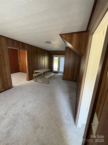 a view of a livingroom with furniture and a window