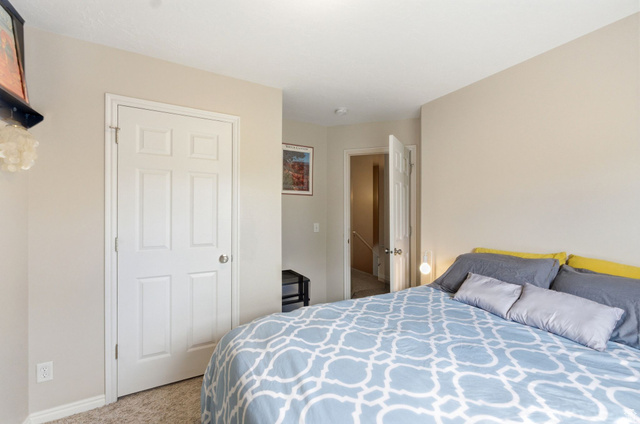 515 Inverness Lane, Unit 207 Heber City, UT 84032 - Photo 16 of 26 Bedroom featuring light colored carpet and baseboards