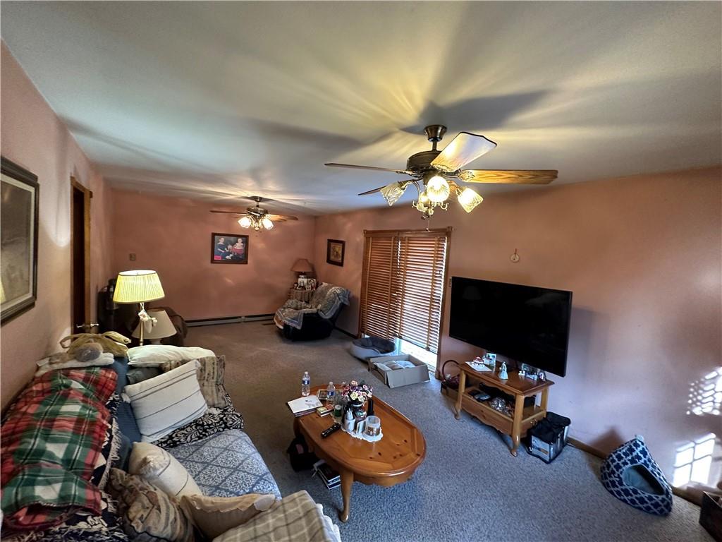 150 Patterson Road Slippery Rock, PA 16057 - Photo 8 of 14 a living room with furniture a flat screen tv and a window